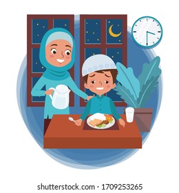 A Muslim mother prepares pre-dawn meal in the month of Ramadan for her sleepy son