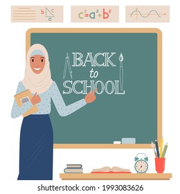 Muslim teacher stands near the school blackboard vector illustration in flat style.
