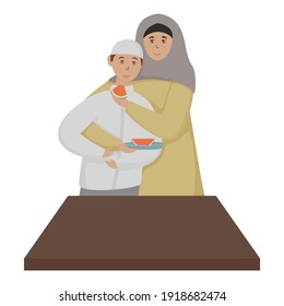 Muslim Woman Feeding Watermelon To Her Son On White Background.