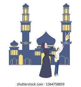 Muslim woman and her child in front of the mosque