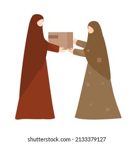 Muslim woman with hijab give zakat to poor woman in ramadan 