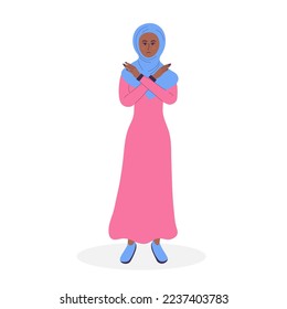 Muslim woman in hijab showing refusal or stop gesture with crossed hands. Body language and nonverbal communication. Expressing Negative emotions, communication, disagree feelings. Break the bias.