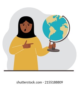 A muslim woman holds a globe in his hand and points his finger at it. The concept of education, teacher, world conquest, ecology. Vector flat illustration