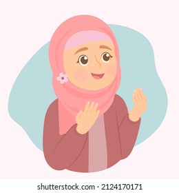 Muslim woman makes traditional prayer to God, keeps hands in praying gesture.