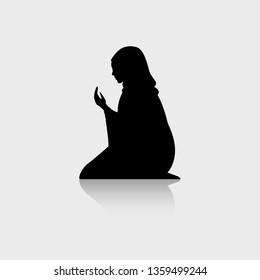 Muslim woman silhouette. Praying. Muslim woman icon isolated on white. Vector