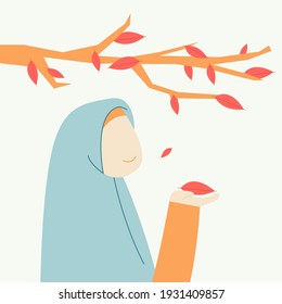 a Muslim woman who is under a fallen leaf
