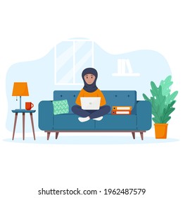 Muslim Woman Works At A Laptop. Freelance Concept.