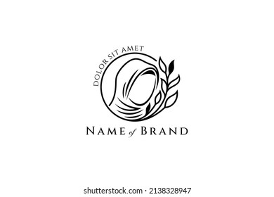 Muslim women's logo in a circular shape decorated with leaves in a flat design style