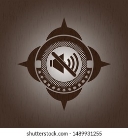 mute icon inside badge with wooden background