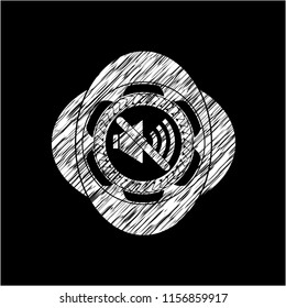 mute icon inside chalk emblem written on a blackboard