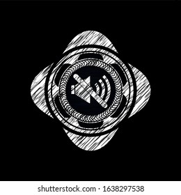 mute icon inside chalk emblem written on a blackboard