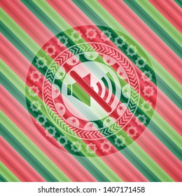 mute icon inside christmas colors badge.