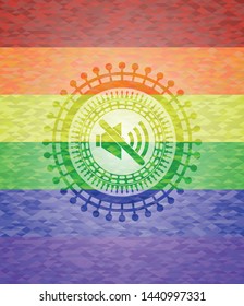 mute icon inside emblem on mosaic background with the colors of the LGBT flag