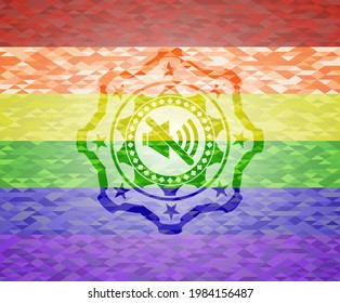 mute icon inside emblem on mosaic background with the colors of the LGBT flag. 