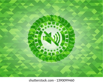 mute icon inside green emblem with mosaic ecological style background