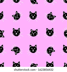 Muzzles of cats are black on a pink background. Pattern for textiles, fabric, wrapping paper, background, Wallpaper.