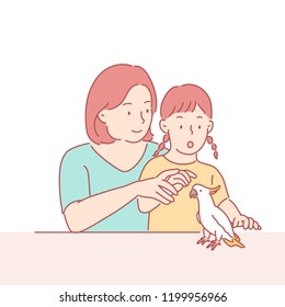 My mother and daughter are looking curiously at the pet parrot. hand drawn style vector design illustrations.