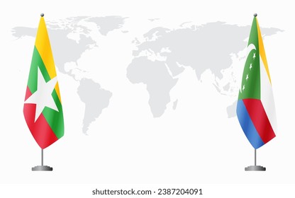  Myanmar and Comoros flags for official meeting against background of world map.