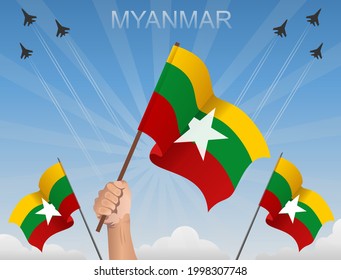 Myanmar flags flying under the blue sky
