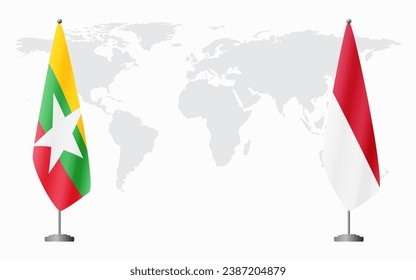  Myanmar and Monaco flags for official meeting against background of world map.