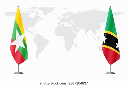  Myanmar and Saint Kitts and Nevis flags for official meeting against background of world map.