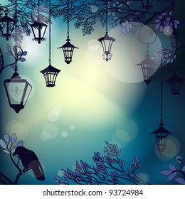 Mystic night background with tree branches and lanterns