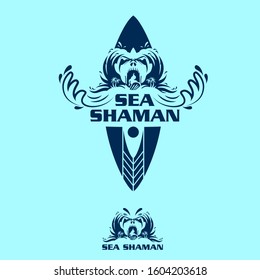 A mystical and powerful vector logo featuring the "Sea Shaman," a tribal ocean spirit emerging from crashing waves. The design incorporates a surfboard silhouette and aggressive wave patterns to form a fierce, mask-like face. Rendered in a cool navy blue on a light cyan background, this professional mascot emblem is ideal for surf brands, extreme water sports, diving clubs, and coastal apparel seeking a unique, spiritual identity.