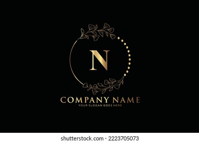 N Beauty vector initial logo, Golden floral letters with flowers leaves and gold splatters isolated on white background. Vector illustration for wedding, greeting cards, invitations template design