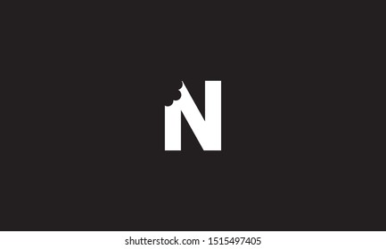 N bite letter logo. Unique attractive creative modern initial N logo with bites shape design
