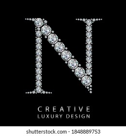 N diamond letter vector illustration. White gem symbol logo for your luxury business, casino, jewelry or web site. Upper letter with many sparkling diamonds isolated on black background.
