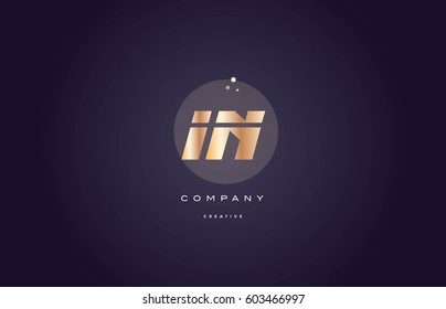 in i n  gold yellow golden metal metallic bold luxury product modern creative gradient alphabet company logo design vector icon template