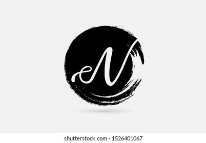 N hand written letter logo alphabet on grunge circle in black and white for icon design. For a logotype on a company or business.