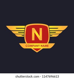 N initial shield with wings gold color logo