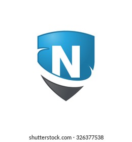 N initial swoosh shield logo blue