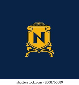 N Letter Initial with Royal Template. Elegant with crown logo vector, Creative Lettering Logo Vector Illustration. Royal shields badges, Coat of Arm Logo Concept.