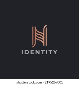 N Letter logo design. Logo created with line stylistic on golden color performance.
