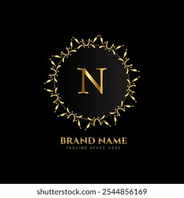 n letter logo design with golden color