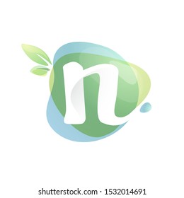 N letter logo with negative space at green watercolor splash background. Vector elements for organic food labels, ecology presentation, card etc.
