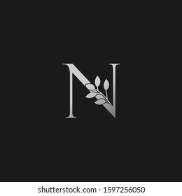 N Letter Logo Silver Classy Vintage  Nature Floral Branch Silhouettes Vector Design Initial Concept.