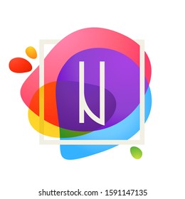 N letter logo in square frame at watercolor splash background. Color overlay style. Vector typeface for labels, headlines, posters, cards etc.