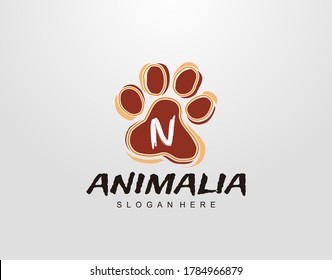 N Letter in Paw Shape Design. Pet logo design. Dog, Cat, animal clinic, pet care center. Paw vector logo Icon Template.