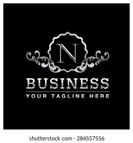 N letter Silver Luxury Logo template flourishes calligraphic elegant ornament lines. Business sign, identity for Restaurant, Royalty, Hotel, Heraldic, Jewelry, Fashion and other vector illustration