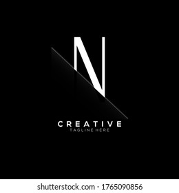 N White Letter Logo Design with Creative Paper Cut