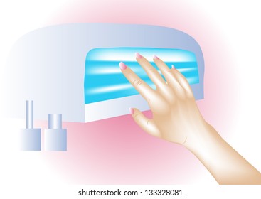 Nail dryer. Female hand with beautiful nails