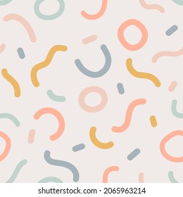 Naive seamless boho pattern with crazy colorful doodle lines of natural tones on a light background. Creative minimalistic trendy background design for kids. Simple childish scribble backdrop.