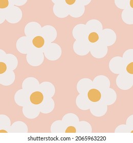 Naive seamless floral boho pattern with white daisies on a peach background in doodle style. Сute contemporary minimalistic trendy boho background design for kids. Scandinavian nursery print 