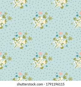 Naive seamless pattern with green and white abstract floral ornament. Blue background with dots. Vector illustration for textiles, wallpaper, surface design, card, wedding invitations.