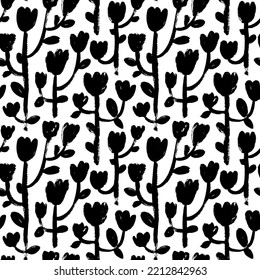 Naive style tulips vector seamless pattern. Brush drawn silhouettes of spring tulip flowers on bold stems with rounded leaves. Hand drawn botanical elements. Naive and primitive style motives.