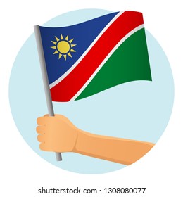 Namibia flag in hand. Patriotic background. National flag of Namibia vector illustration