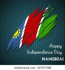 Namibia Independence Day Patriotic Design. Expressive Brush Stroke in National Flag Colors on dark striped background. Happy Independence Day Namibia Vector Greeting Card.